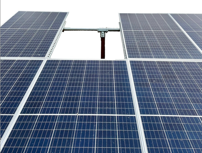 Ground mounted solar array on galvanized pipe using array top caps