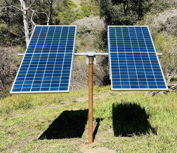 Top of pole solar mount holding two solar panels on a 3 inch ground pipe